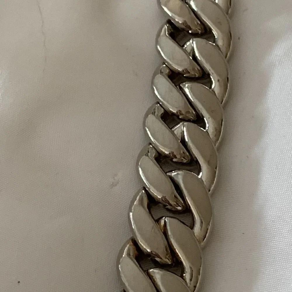 YSL silver chain link belt leaf design